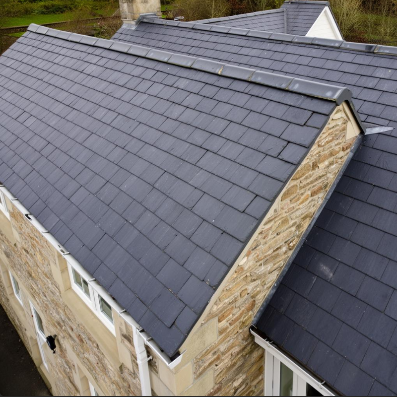 Aerial view of a slate roof on a stone period property
